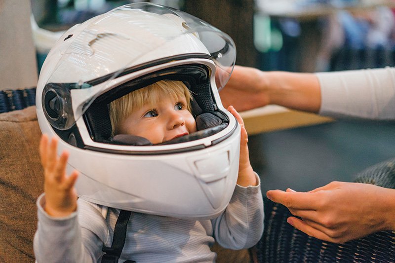 Kid wearing large helmet